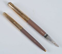 A Parker 51 half-demonstrator fountain pen and ballpoint pen, in Cocao with gold trim, the