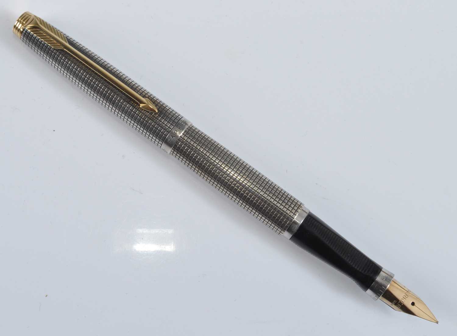 A Parker 75 Cisele fountain pen, in silver crosshatch with gold plated fittings, the cap with