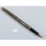 A Parker 75 Cisele fountain pen, in silver crosshatch with gold plated fittings, the cap with