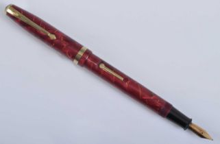 A Conway Stewart 85L fountain pen, in rose marble with gold trim, the barrel engraved The Conway