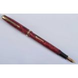 A Conway Stewart 85L fountain pen, in rose marble with gold trim, the barrel engraved The Conway