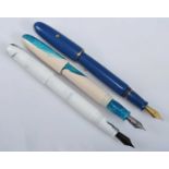 Three Clyde Pen Company fountain pens, being a Blue Torpedo with gold filled trim, Life's a Beach