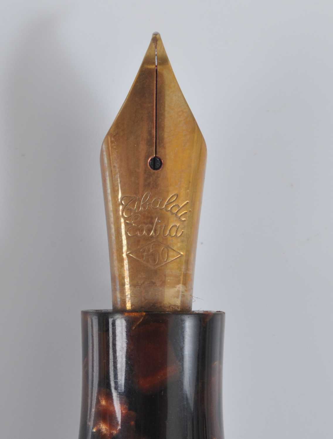 A cased Tibaldi Iride fountain pen, in transparent red celluloid with gold trim, the branded nib - Image 2 of 6