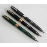 Three Sheaffer Compact fountain pens, circa 1960s, being black with 14k gold fittings and stamped