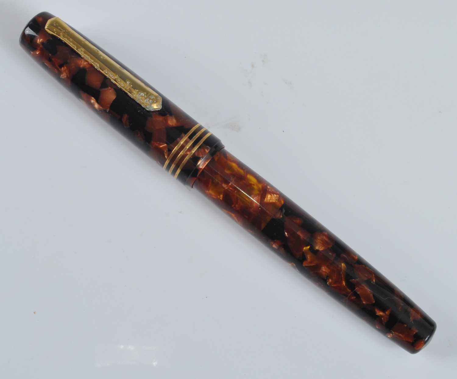 A cased Tibaldi Iride fountain pen, in transparent red celluloid with gold trim, the branded nib - Image 5 of 6