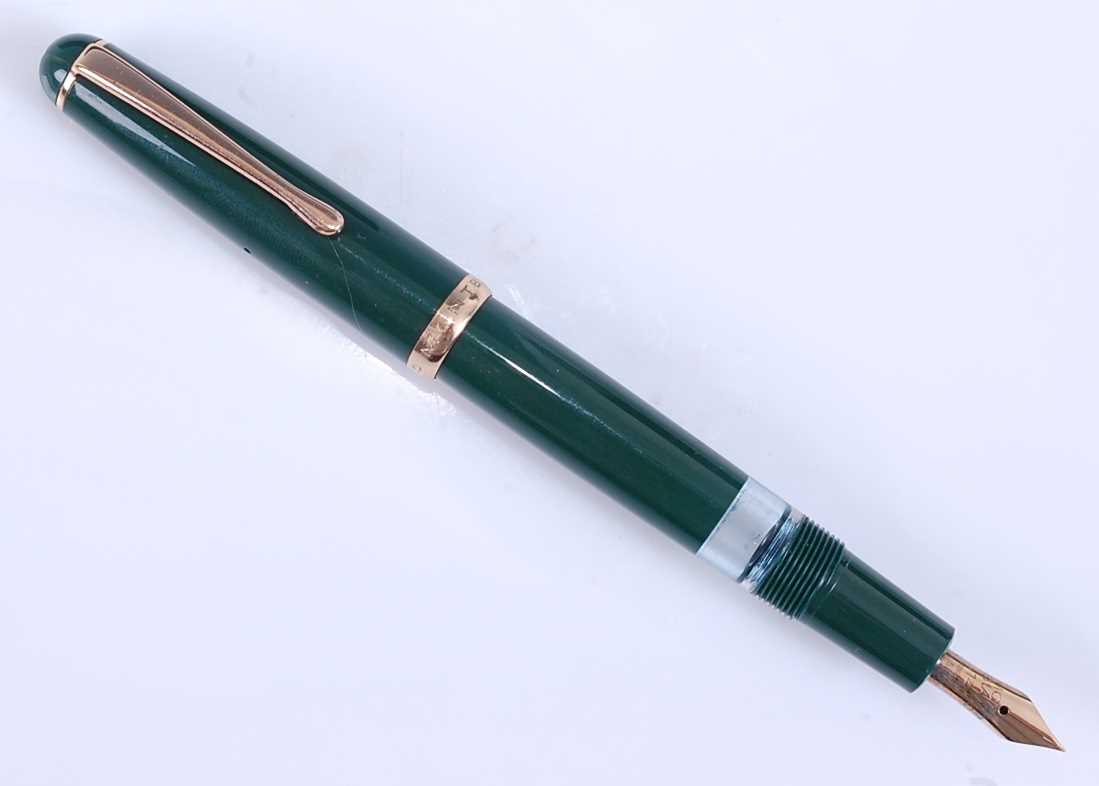 A Montblanc 342 fountain pen, green with gold plated fittings, the blind cap base inscribed EF,