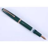 A Montblanc 342 fountain pen, green with gold plated fittings, the blind cap base inscribed EF,