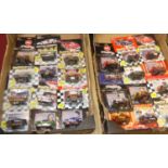 Three trays containing a quantity of small scale Racing Champions Nascar related carded diecast