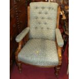 A mid-Victorian mahogany framed and buttoned floral upholstered gentleman's armchair, width 67cm