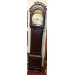 An early 19th century mahogany long case clock, having an arched painted dial, eight day movement