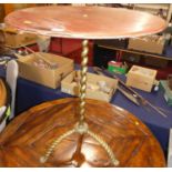 A painted hard wood circular topped occasional table, raised on spiral turned brass base, dia. 61cm