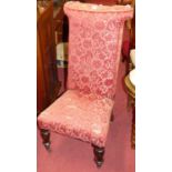 A Victorian mahogany and red floral needlework upholstered prie-dieu (losses and damages to