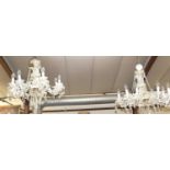 A pair of good quality contemporary cut crystal glass hanging eight-light chandeliers, with