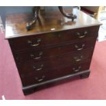 A George III mahogany bachelor's chest, having a well fitted top drawer, with centre hinged