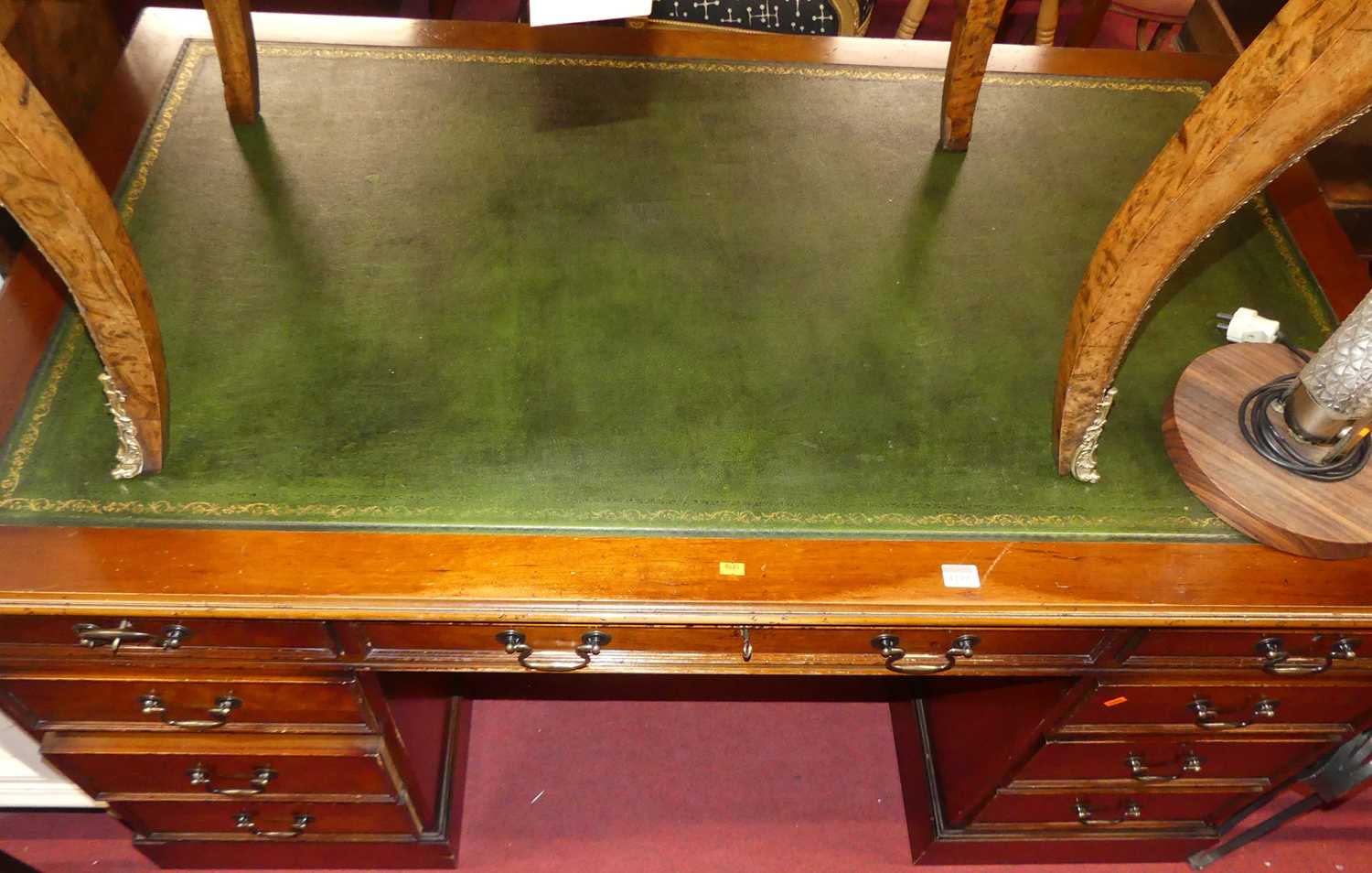 A contemporary yew wood and green gilt tooled leather inset twin pedestal writing desk, width 152cm