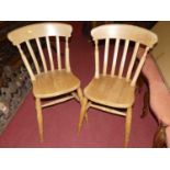 A set of six contemporary beech slat back kitchen chairs