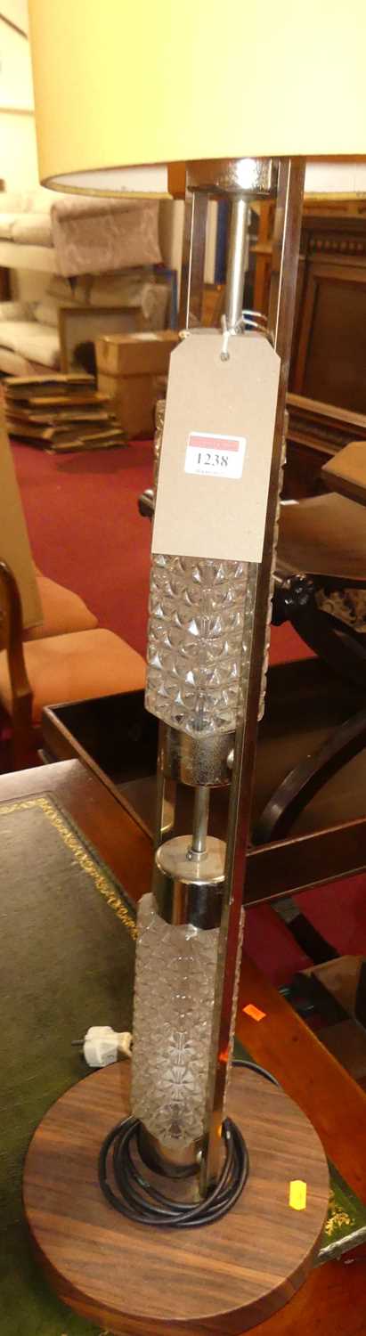 A 1970s chrome and moulded glass standard lamp with tall cylindrical shade