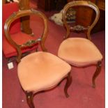 A set of four Victorian rosewood balloon back salon side chairs, together with a pair of further