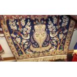 A Persian woollen blue ground rug, decorated with animals within foliage, 130 x 85cm