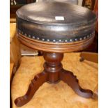 A mahogany and leather topped swivel music stool, height 57cmLegs are good, no signs of worm.