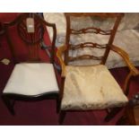 A pair of mahogany ladderback elbow chairs, with floral upholstered damask seats; and a