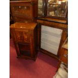 A Victorian figured walnut and satin wood inlaid and gilt metal mounted single door glazed pier