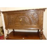 A floral relief carved oak hinge topped blanket box, width 106cm