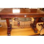 A mid-Victorian mahogany round cornered table buffet, having three tiered rise and fall action,