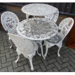 A Victorian style pierced and floral decorated white painted galvanised metal garden suite,