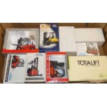 Nine various boxed forklift related diecasts, to include a Nissan T-79 Japanese example