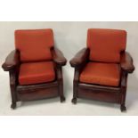 A pair of Art Deco oak framed and tan leather upholstered club armchairs, each having flattened