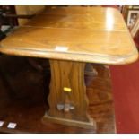 A small oak drop flap swivel top low occasional table