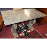 A grey variegated marble topped console table, raised on painted reconstituted stone pedestal end