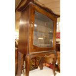 An Edwardian stained wood single door glazed music cabinet, width 63cm