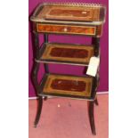 A circa 1900 French amboyna ebonised inlaid and further gilt metal mounted three tier etagere (