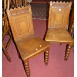 A pair of late Victorian oak panelled seat hall chairs, on bobbin turned forelegs