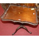 A 19th century mahogany shaped and galleried tilt top pedestal tripod table, width 59cm