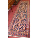 A caucasian blue ground woollen hall runner, 375 x 115cm