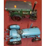 Two tinplate replica models, one being a live steam roller, the other a Fordson tractor