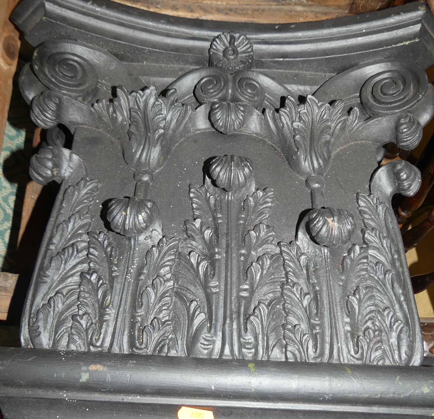 A pair of contemporary black painted and carved hardwood wall mounted composition capitals, each