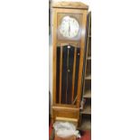 A 1930s oak long case clock, having pendulum and three weights, height 192cm