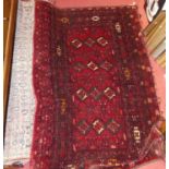 Three various Persian woollen rugs to include; red ground Bokhara example