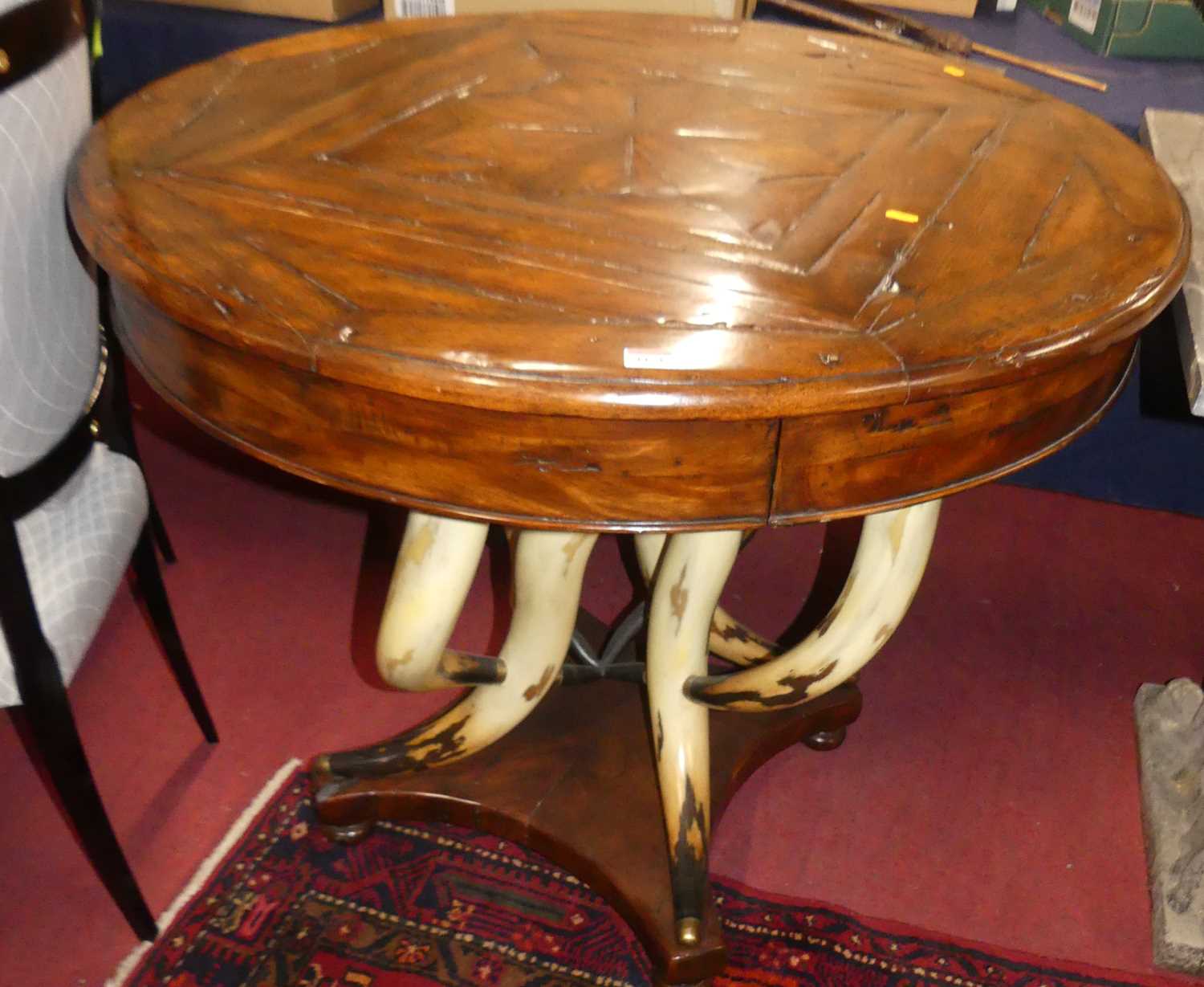 A contemporary joined reclaimed timber circular pedestal centre table by Theodore Alexander,