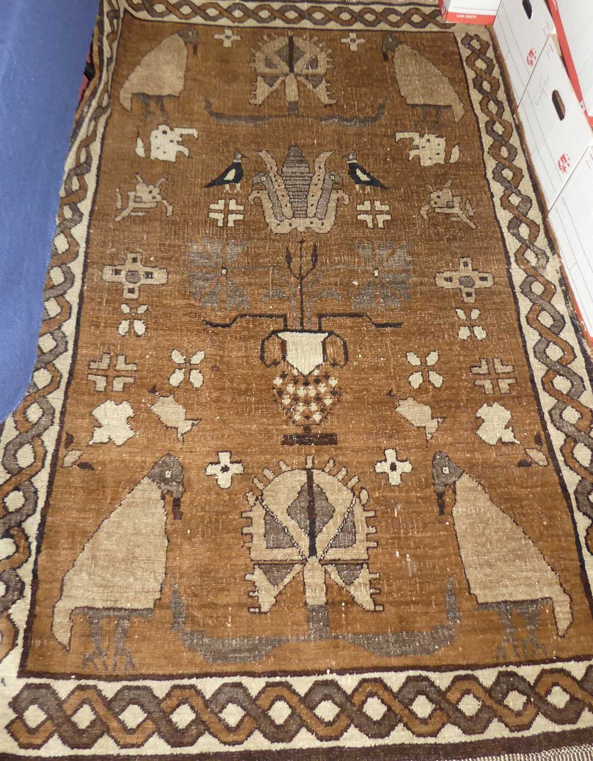 A Turkish woollen brown ground pictorial rug, 195 x 130cm, together with a Turkish woollen blue