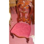 A Victorian carved mahogany prie-dieu, with reupholstered stuff over seat and hinged upper