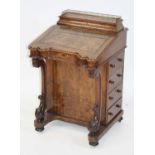 A Victorian walnut and satinwood inlaid writing Davenport, the hinged top with brass gallery,
