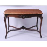 An early 20th century French walnut centre table, having a rouge marble top of serpentine outline,