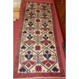 A Turkish woollen cream ground hall runner, 190 x 79cm