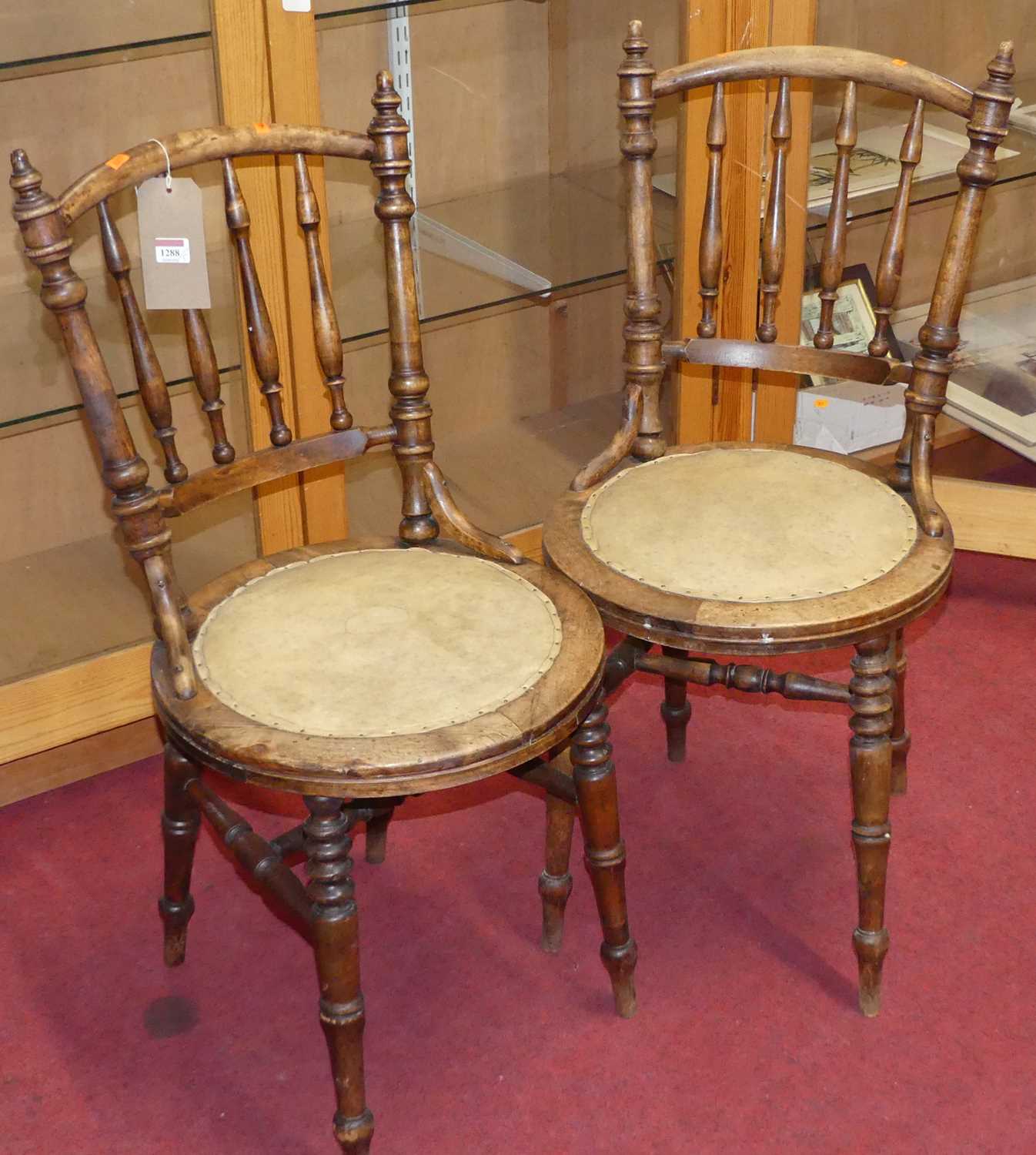 A pair of early 20th century turned beech pub chairs, together with stick back elbow chair,