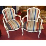 A pair of French white painted and striped upholstered tub fauteuils, in the Louis XV taste, width